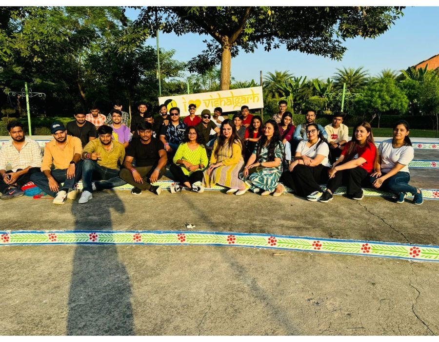 A group of young multi ethnic group of student in university smiling and looking at the tablet